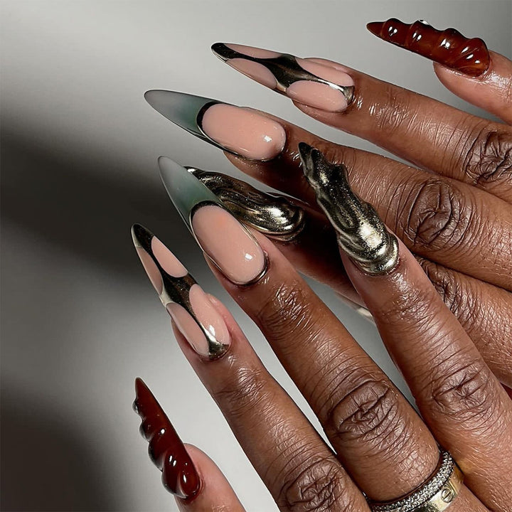 Artistic Stiletto Nails with Glitter and Metallic Effects Stornfield