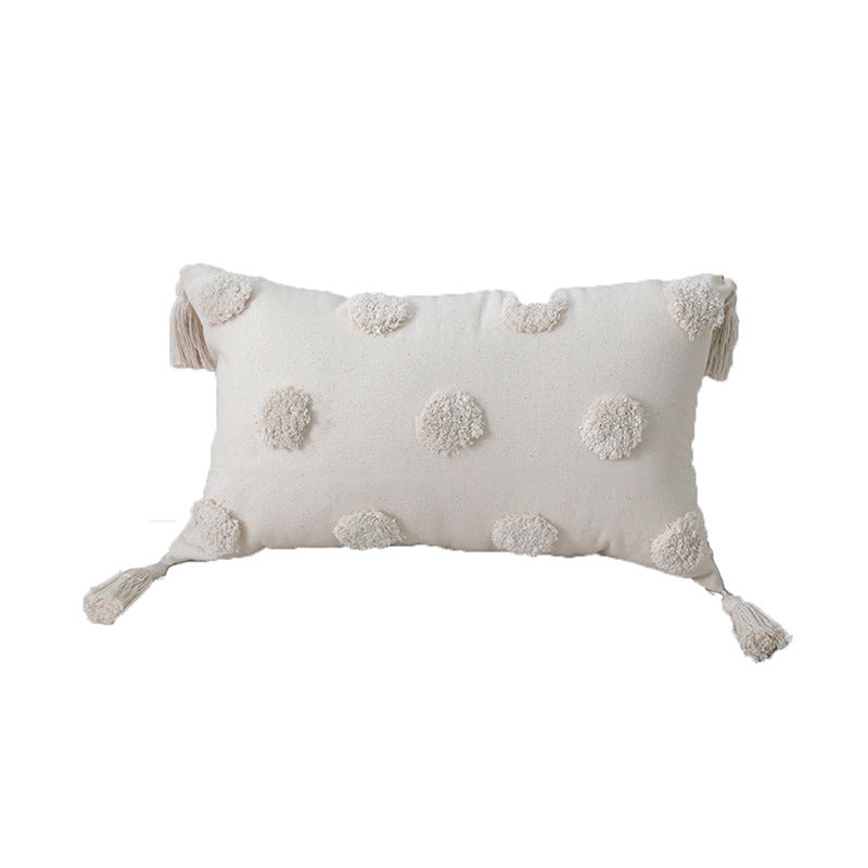 Decorative cushion with tassels and texture