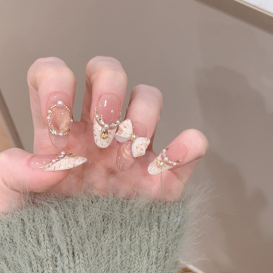 Artificial nails with elegant accents and rhinestone embellishments Stornfield