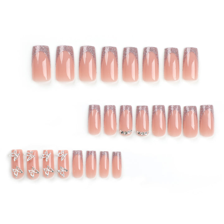 Artful Nail Extensions with Glitter and Decorative Accents Stornfield
