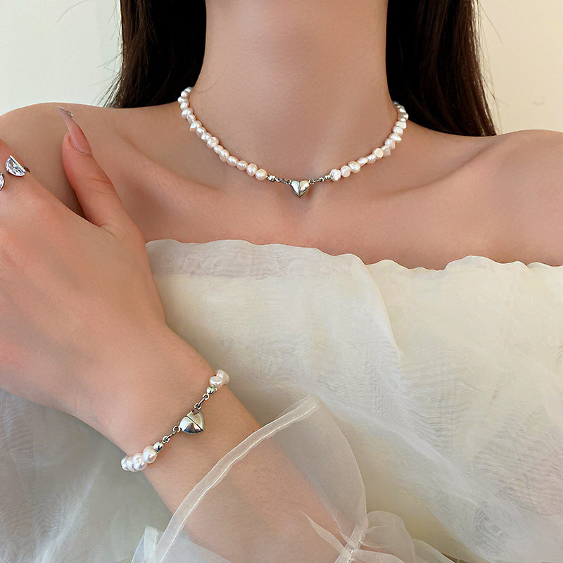 Elegant silver pearl bracelet with heart details Stornfield