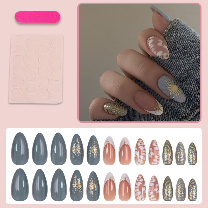 Nail art set with elegant gold accents and creative design Stornfield