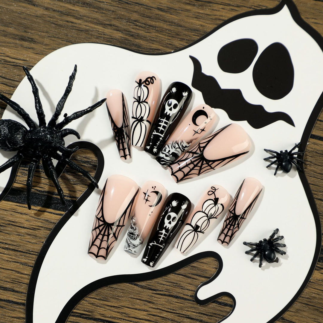 Artificial nail art in Halloween style with graffiti designs Stornfield