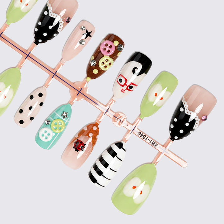 Creative nail art set with playful patterns and 3D details Stornfield