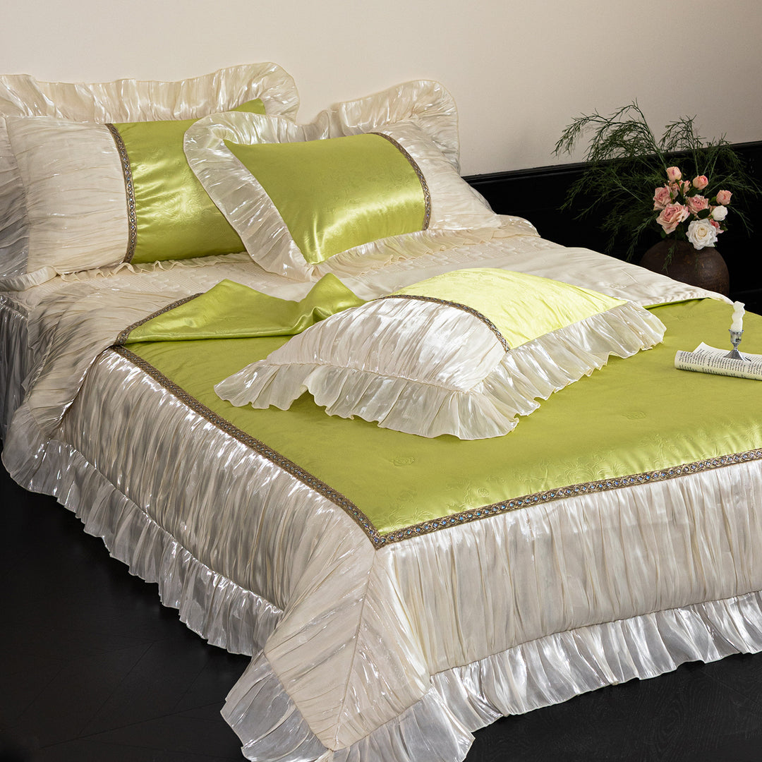 Opulent ruffled bedspread and pillow set made of satin with decorative border
