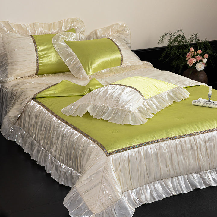 Opulent ruffled bedspread and pillow set made of satin with decorative border
