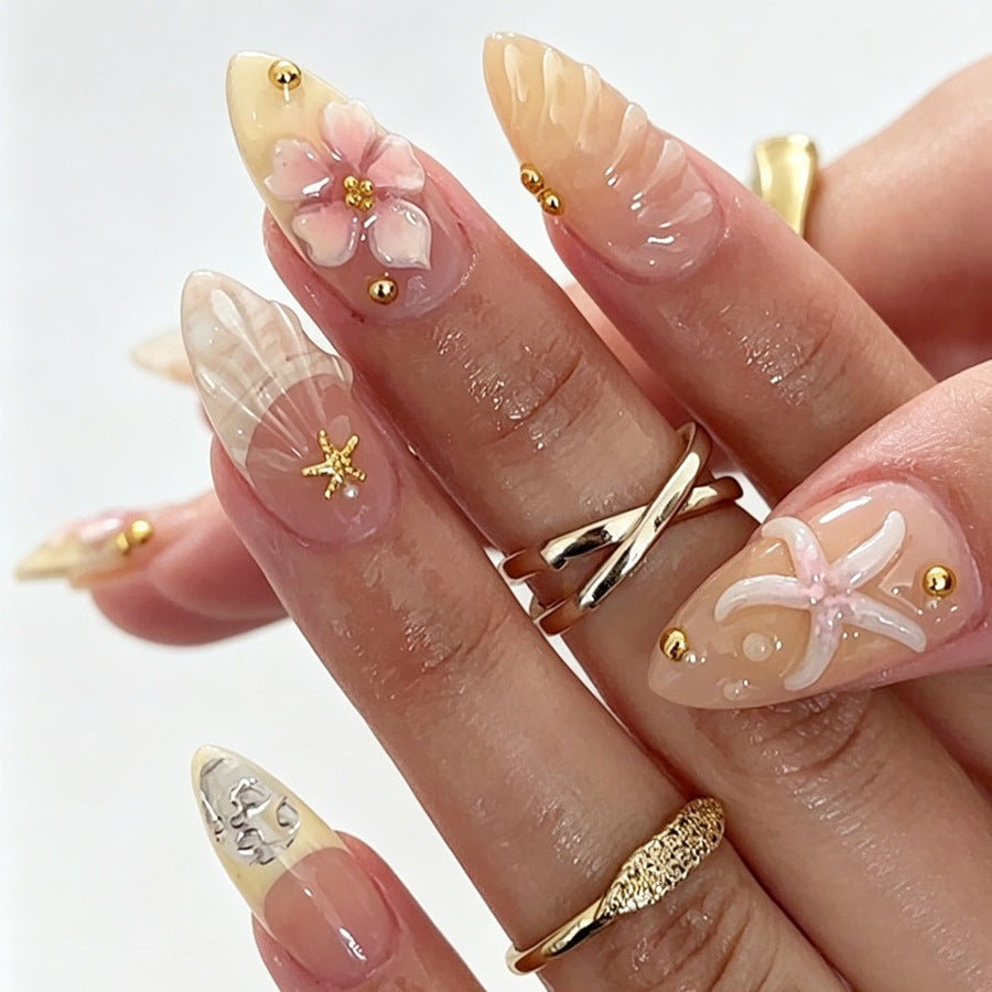 Artificial nail set with floral 3D elements and golden accents Stornfield