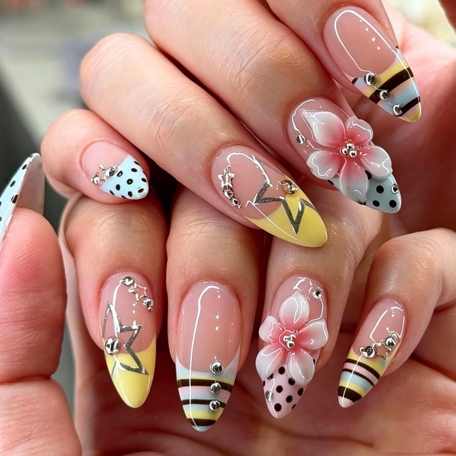 Artificial nail set with stylish floral accents and glitter details Stornfield