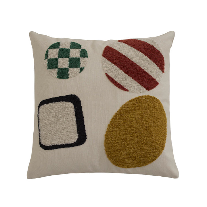 Square cushion cover with hand-tufted geometric applications