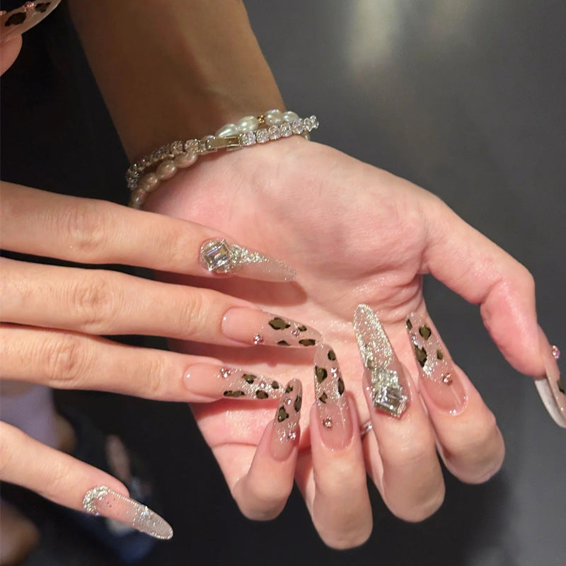 Glamorous artificial nail set with fun leopard pattern and glittering accents Stornfield