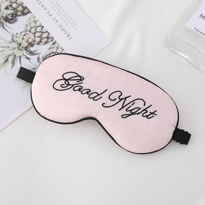 Unisex embroidered contoured sleep mask with decorative text embroidery and adjustable elastic band Stornfield