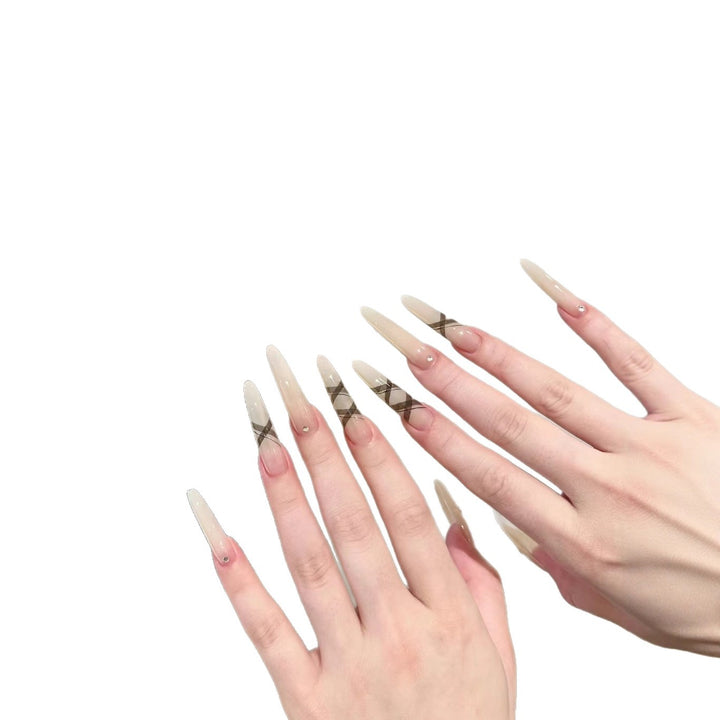 Elegant Stiletto Nail Enhancements with Artistic Accents