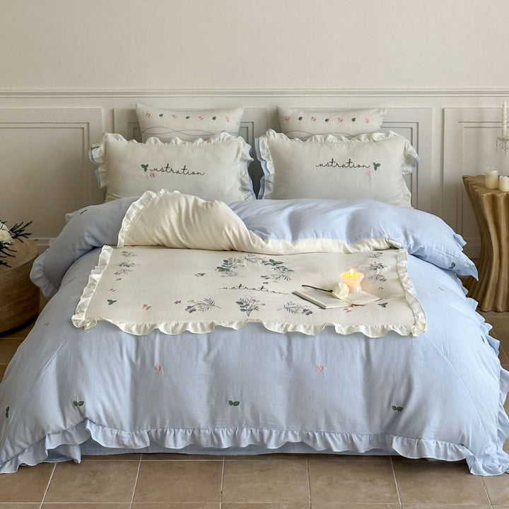 Bedding set with ruffles, embroidered middle cover and delicate flower application
