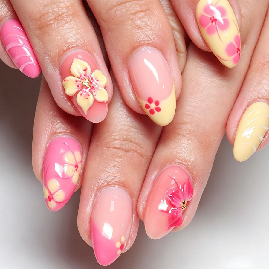 Artificial nail set with floral accents and glitter elements Stornfield