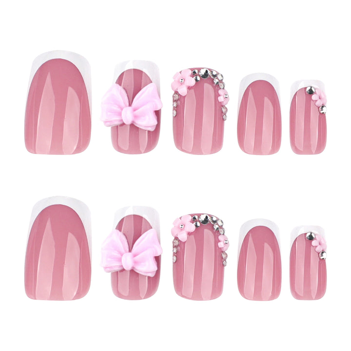 Artful nail extensions with sparkling accents and bow decorations Stornfield