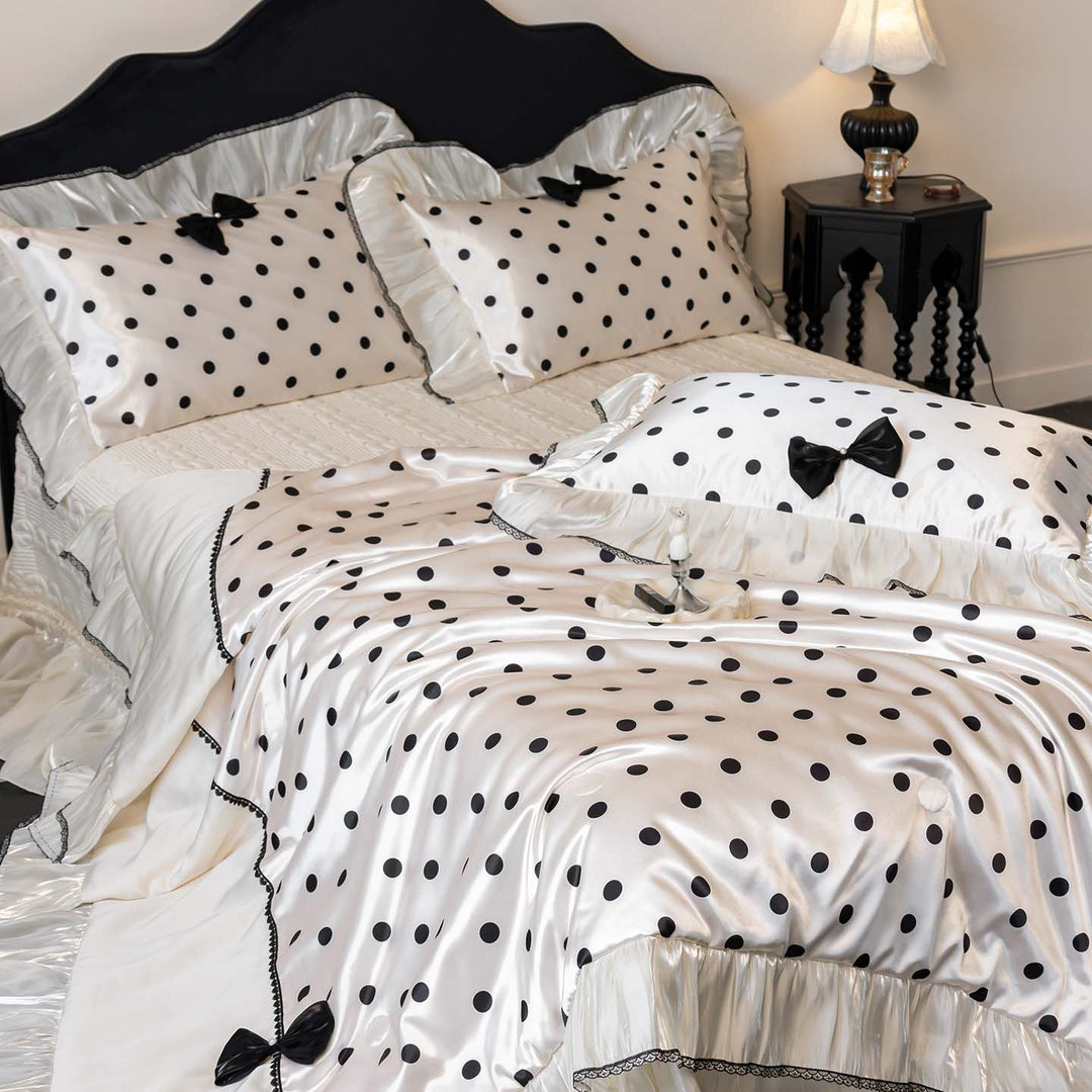 Romantic polka dot satin bedding set with ruffles and decorative ribbons