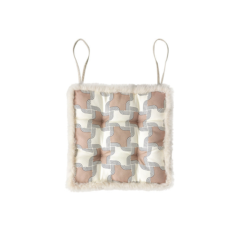 Padded seat cushion with fastening straps and faux fur edge