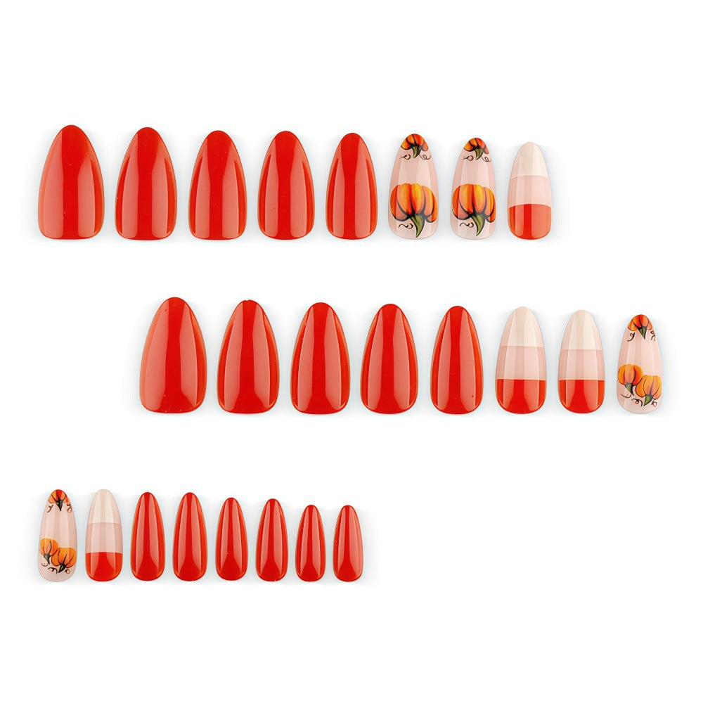 Artificial nails in autumn pumpkin design Stornfield