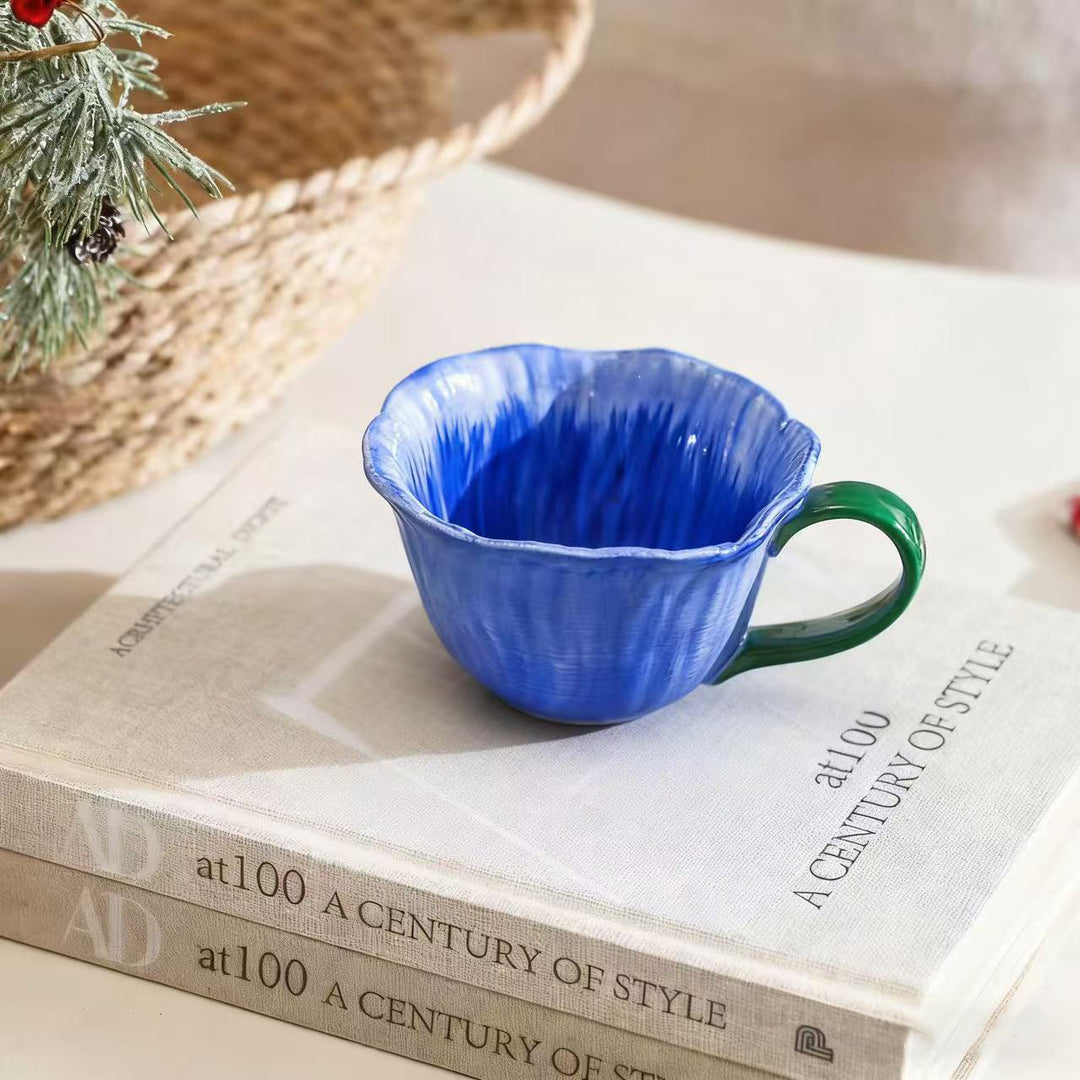 Ceramic mug with saucer in flower shape