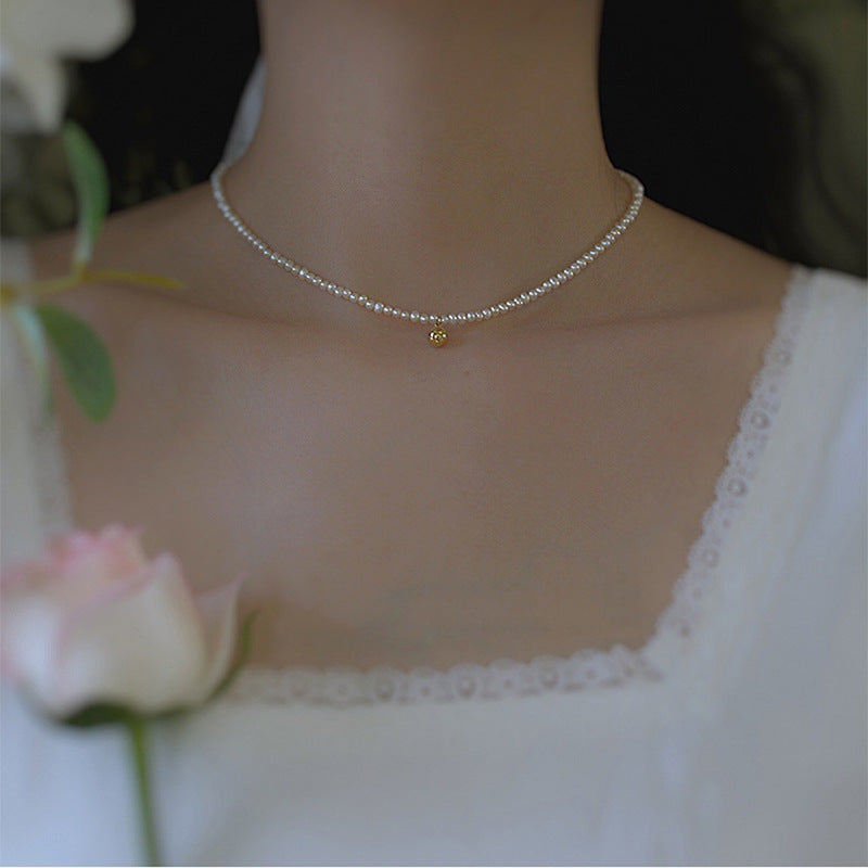 Delicate pearl necklace with elegant gold accent chain Stornfield