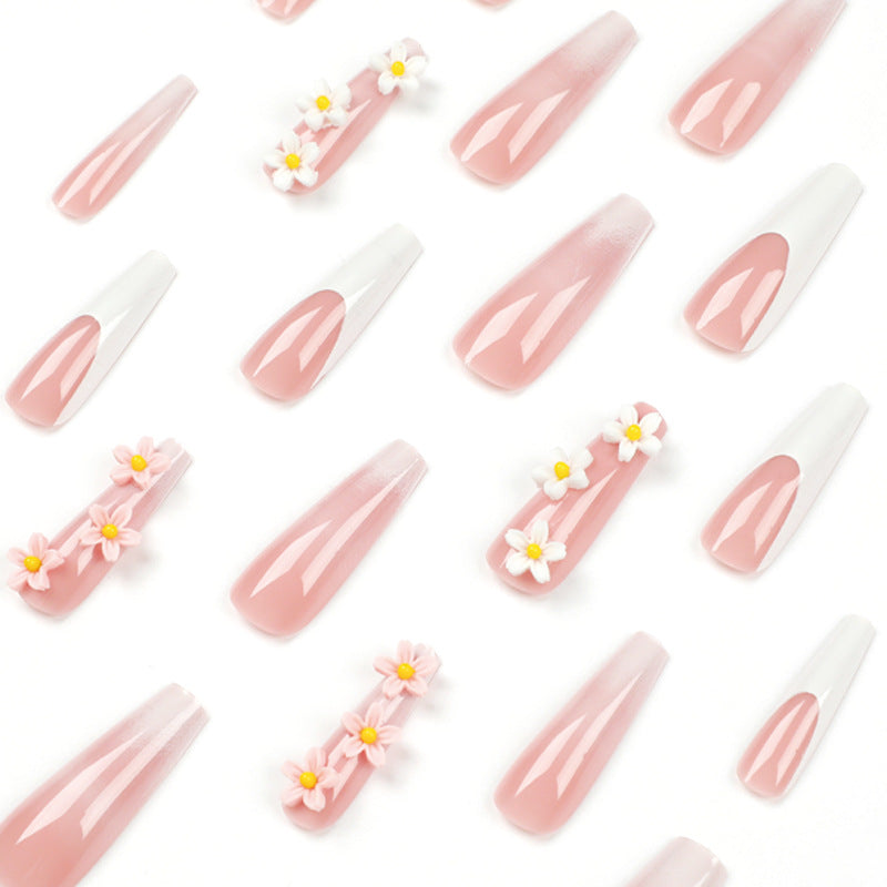 Artful nail extensions with elegant gradient and creative floral accents Stornfield