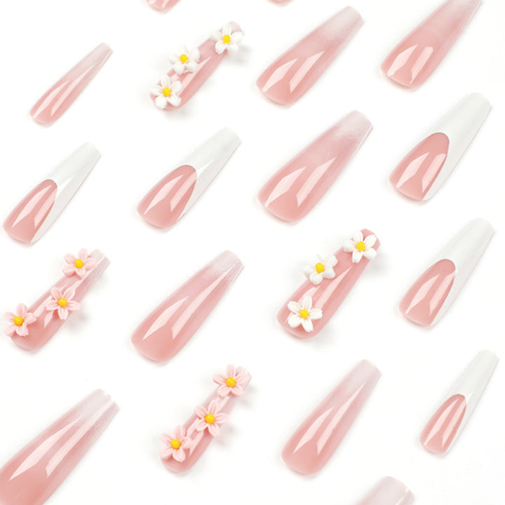 Artful nail extensions with elegant gradient and creative floral accents Stornfield