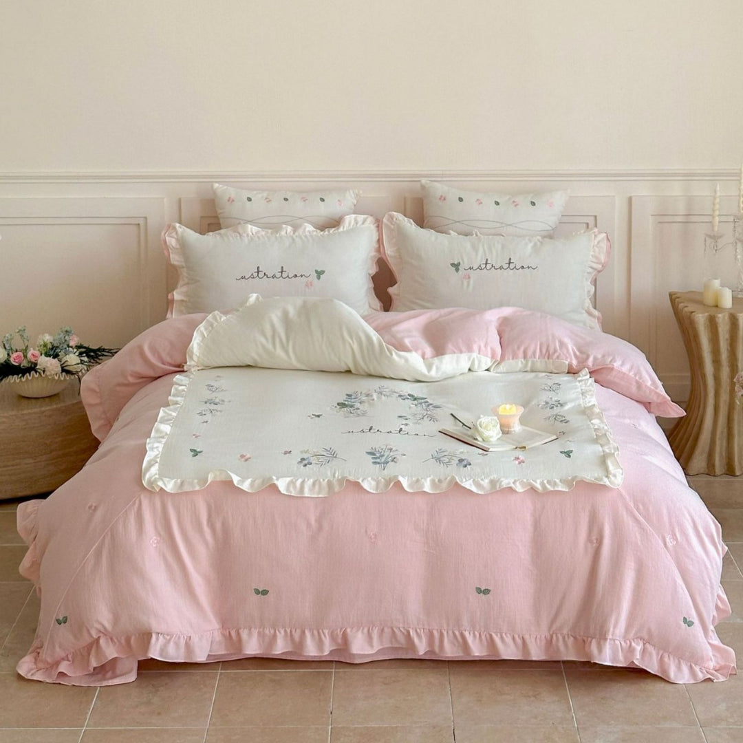 Bedding set with ruffles, embroidered middle cover and delicate flower application