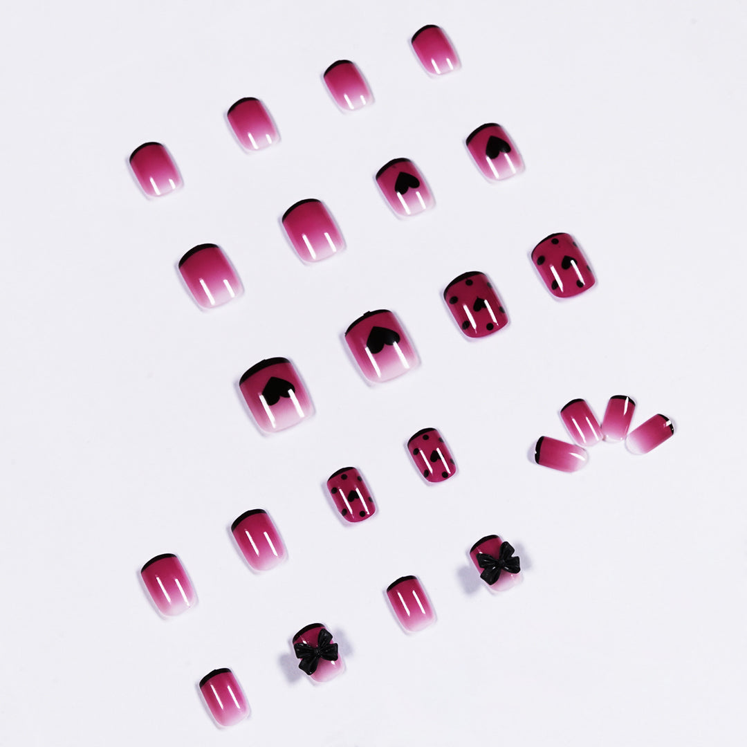 Artistic nail extensions with cute bow and heart designs Stornfield