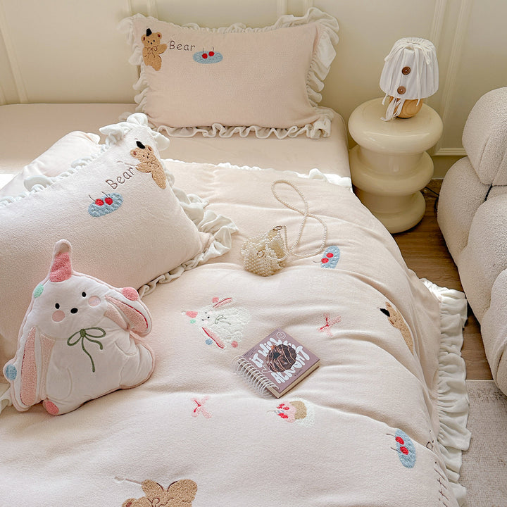 Bedding set with plush surface, ruffled hem and cute embroidery designs