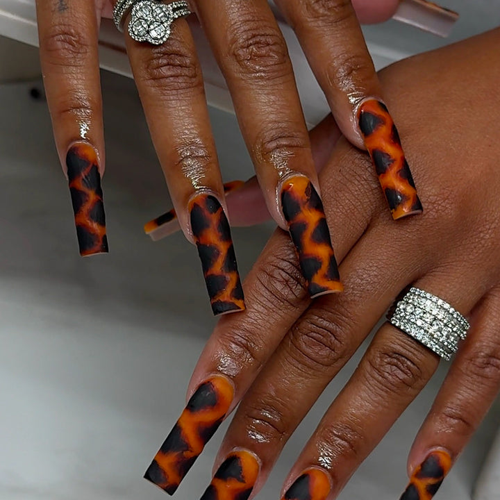 Artificial nails in creative leopard design Stornfield