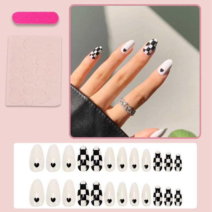 Artificial nail set with graphic heart and check pattern Stornfield