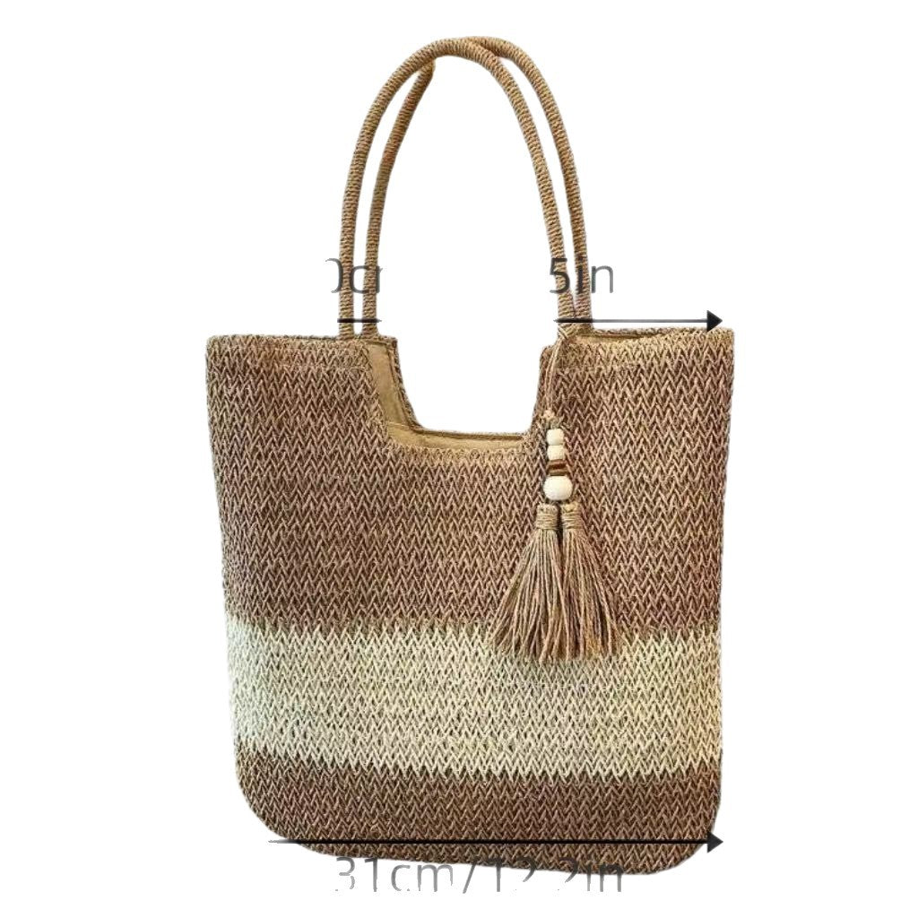 Handbag made of braided natural material with tassel details Stornfield