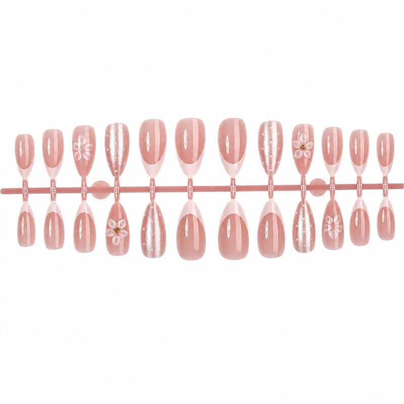 Artificial nail set with elegant French tips and delicate floral accents Stornfield