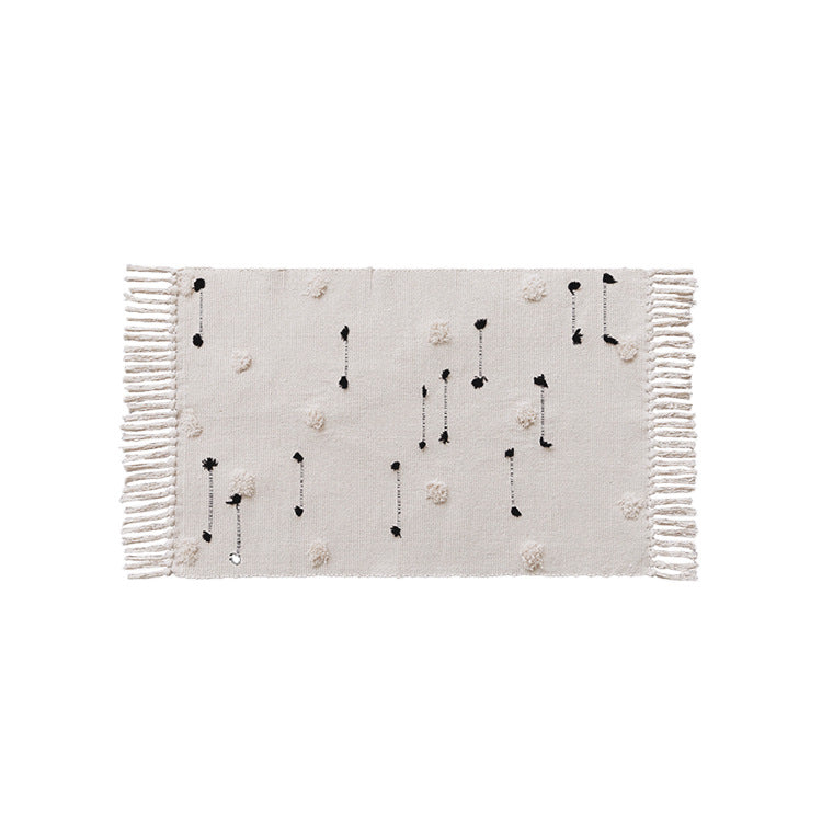 Handwoven cotton runner with pompom tufting and decorative fringes