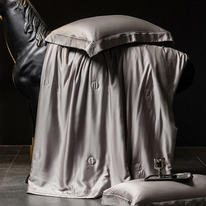 Luxurious satin bed set with silk-like surface and fine decorative stitching