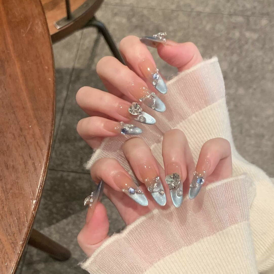 Artistic Stiletto Nail Enhancements with Decorative Accents