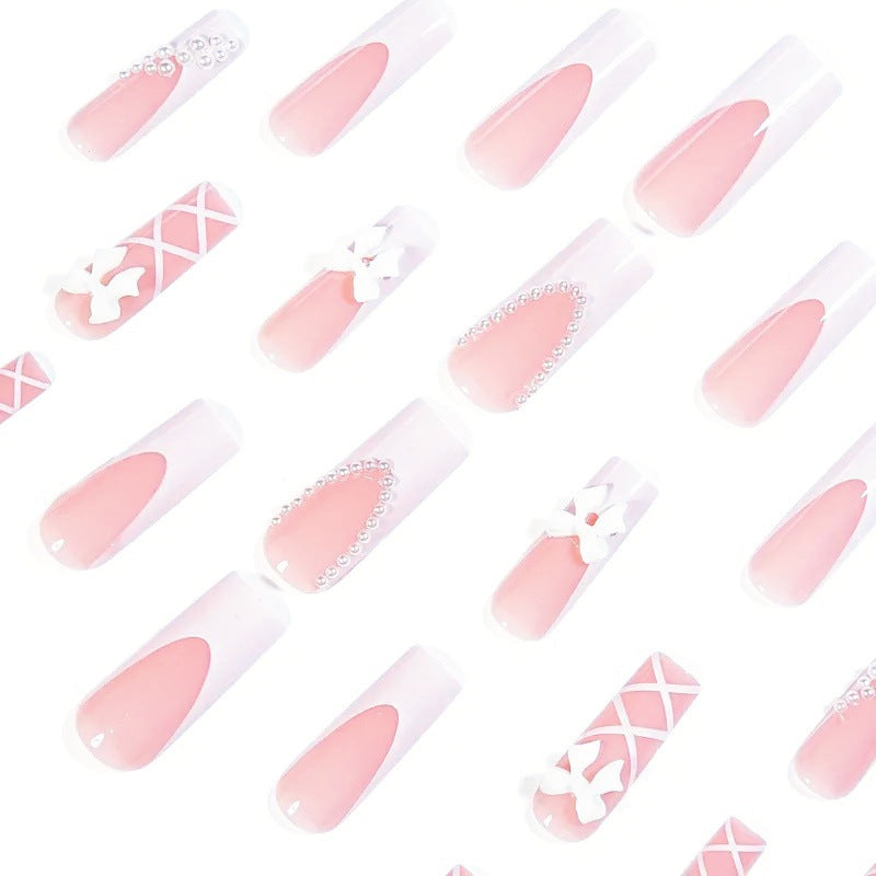 Artificial nail set with elegant 3D bows and pearl embellishments Stornfield