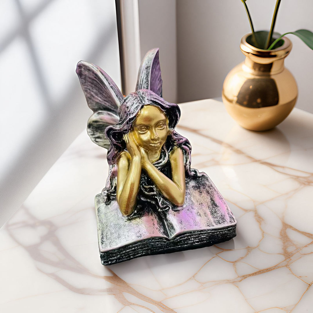 Fairy Figurine Sitting on Books Stornfield