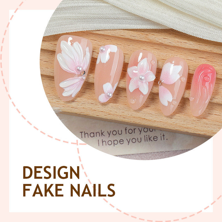 Artificial nail set with floral motifs and rhinestone decorations Stornfield