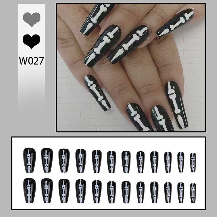 Artistic nail art with skull and bone motif Stornfield
