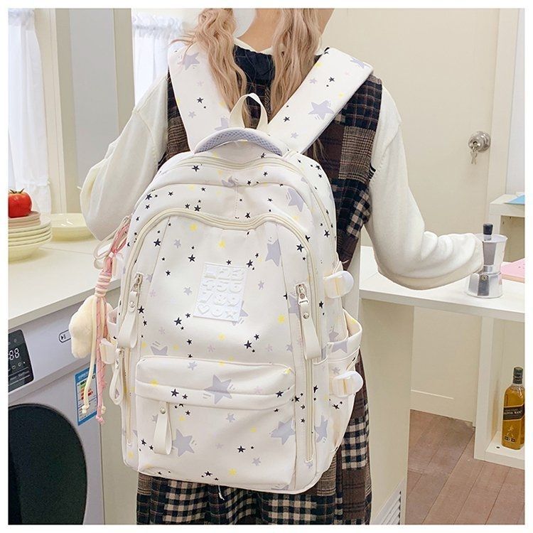 Playful backpack with star motifs and practical functions Stornfield