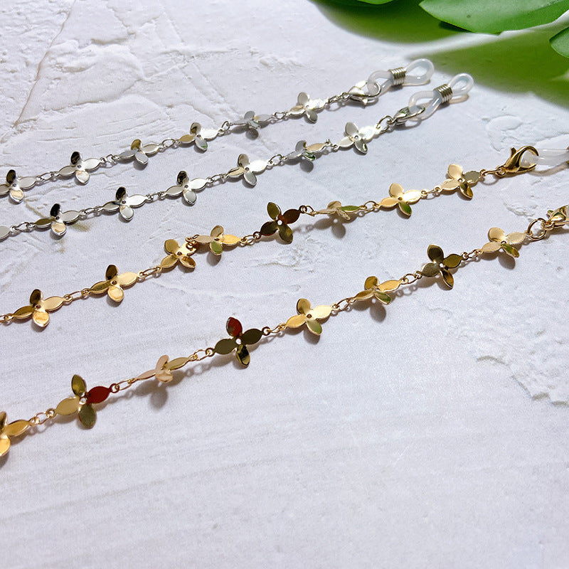 Fashionable glasses holder chain with filigree flower pendants Stornfield