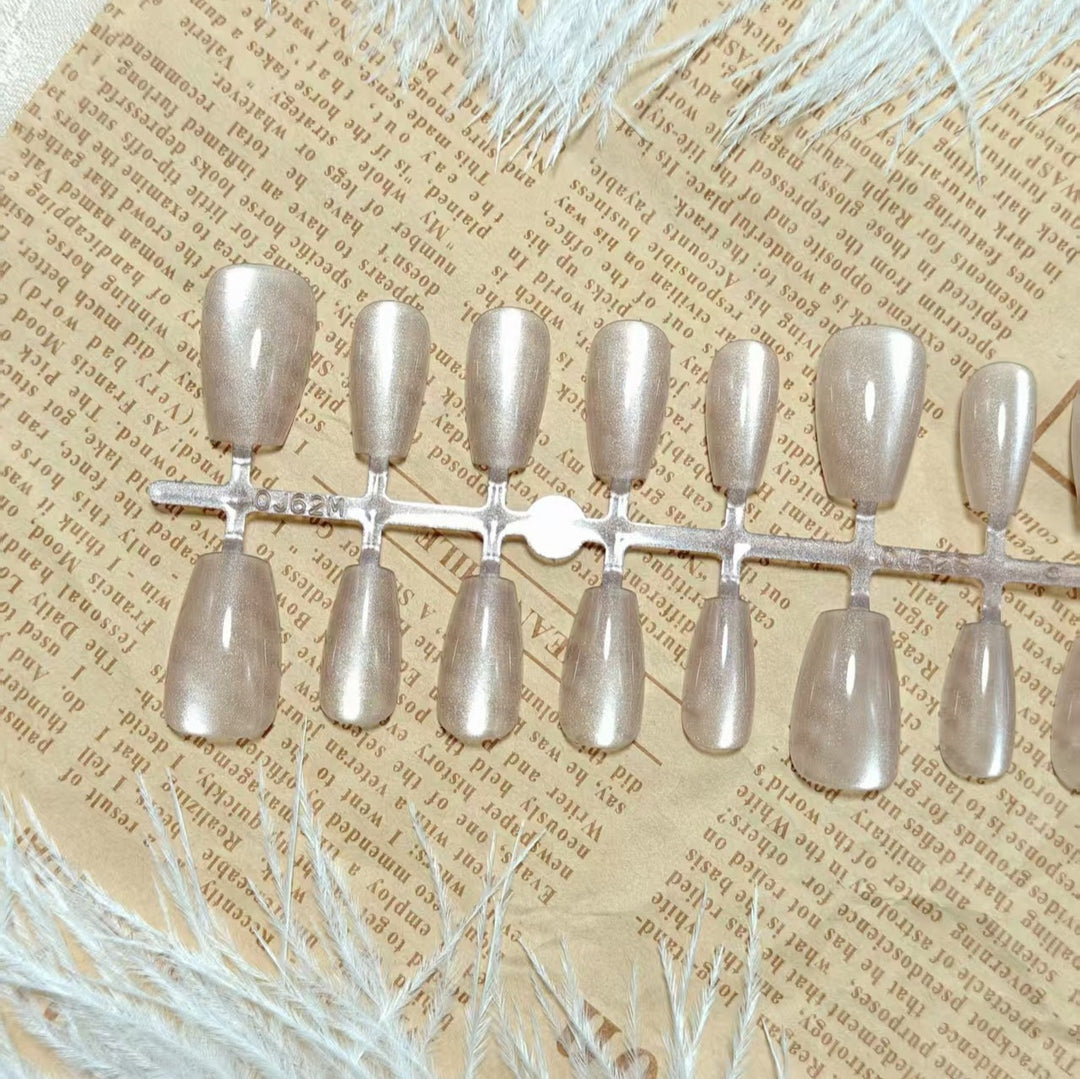 Artificial nails in elegant nude glitter design Stornfield