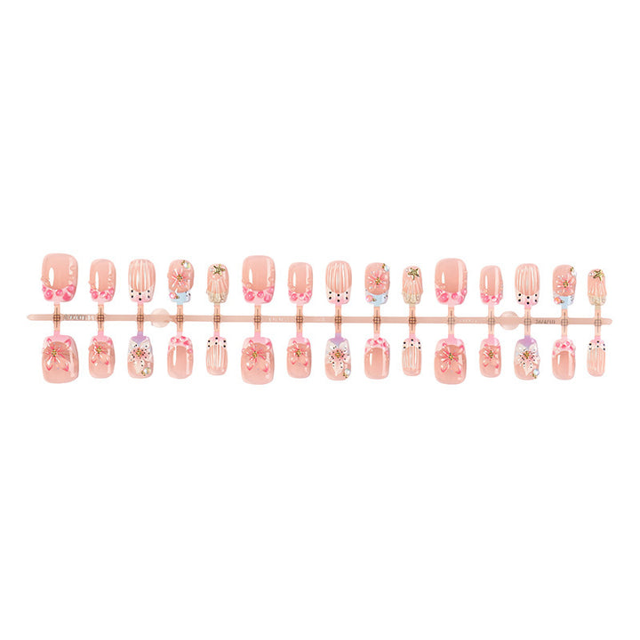 Artificial nail set with floral designs and elegant glitter elements Stornfield