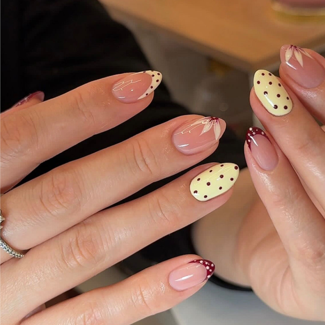 Artificial nail art with playful dots and bows Stornfield