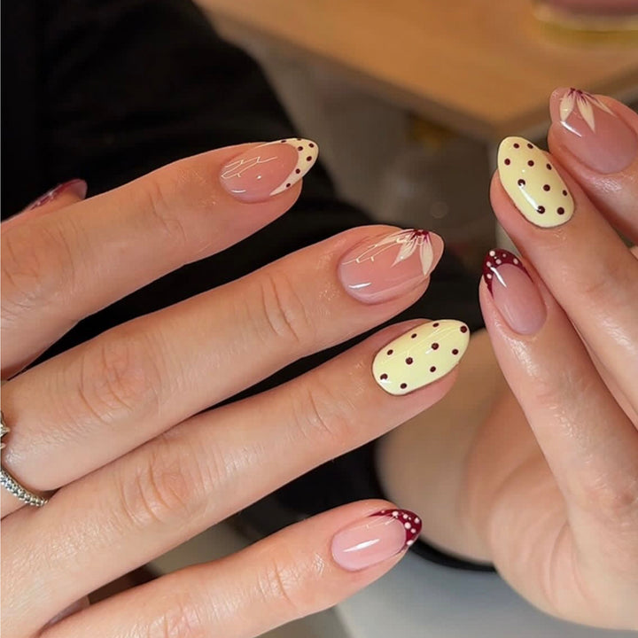 Artificial nail art with playful dots and bows Stornfield