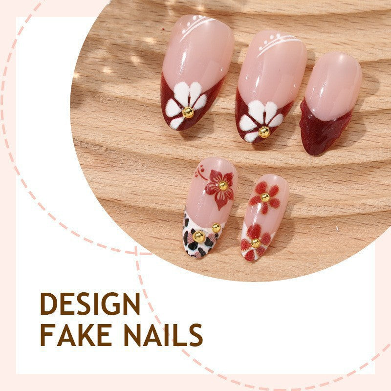 Elegant artificial nails with floral accents and glitter Stornfield