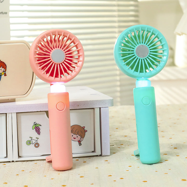 Women portable mini hand fan with integrated LED lighting and USB charging function Stornfield