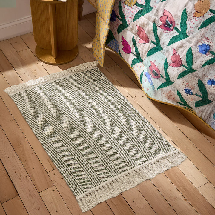 Braided runner rug with herringbone pattern and fringe edge Stornfield