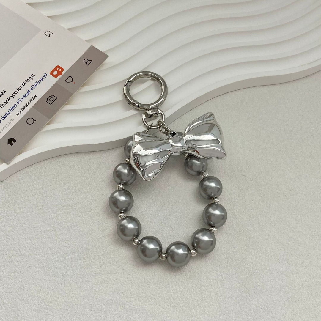 Elegant Pearl Bow Keychain Stornfield